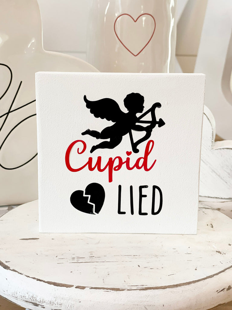 Cupid Lied Sign